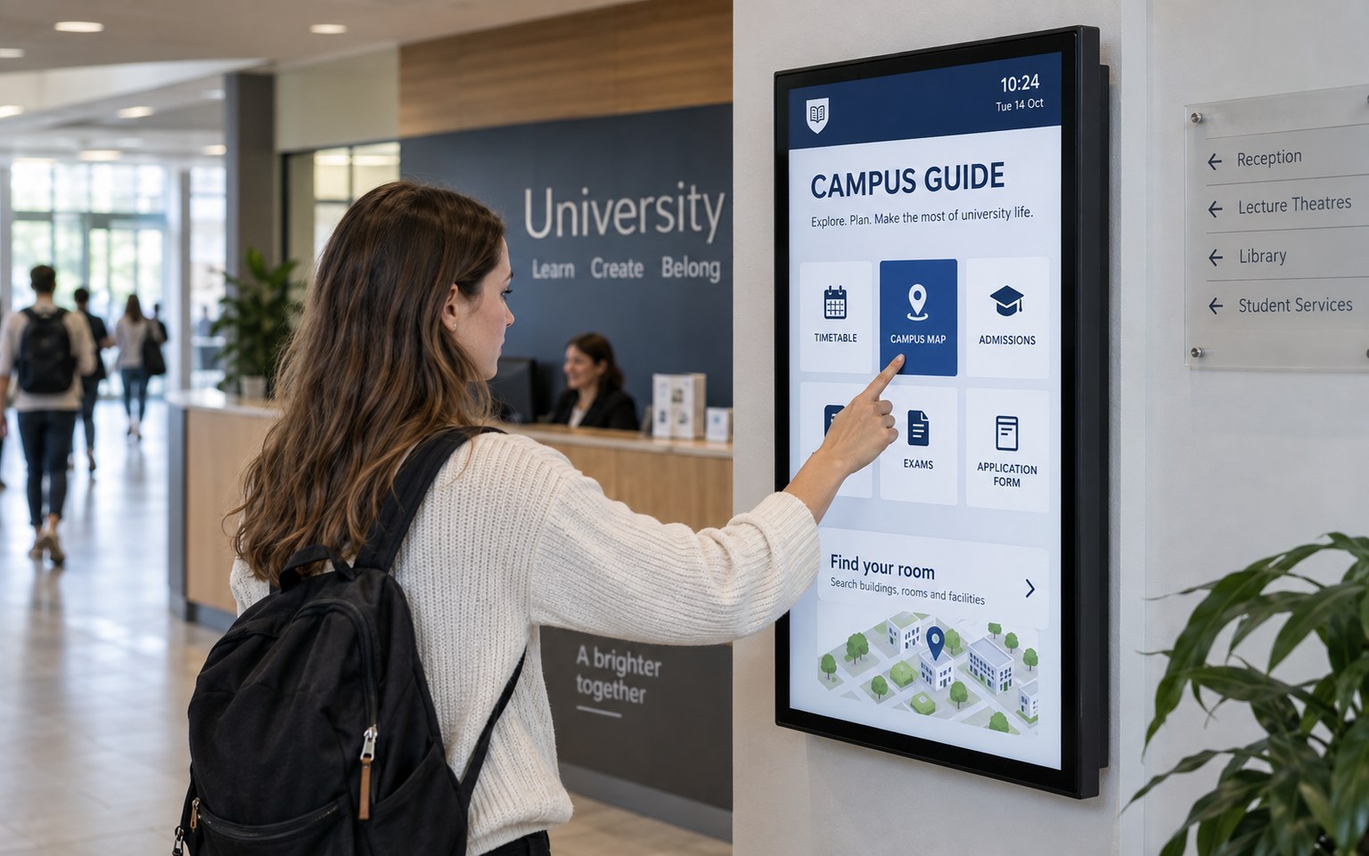 Student using a compact wall-mounted touchscreen for university schedules and services